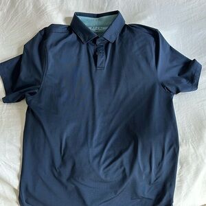 Rhone Golf Sport Polo, sized small in navy blue